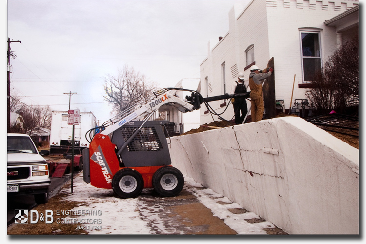 Helical Piles used for Underpinning a Foundation so that a Retaining Wall could be repaired in Denver, Colorado